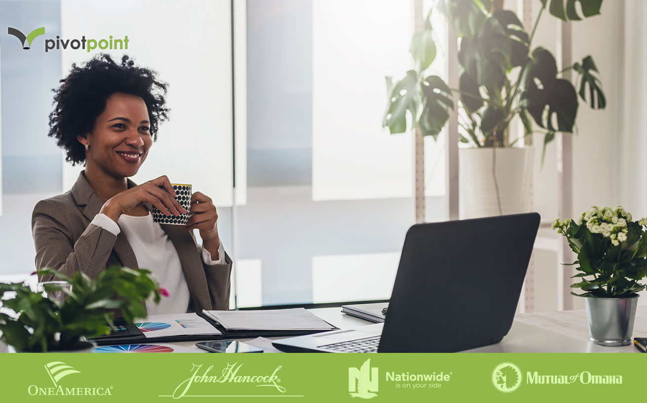 Business woman at computer with coffee