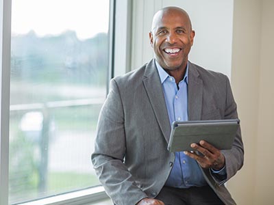 Successful Businessman by Window