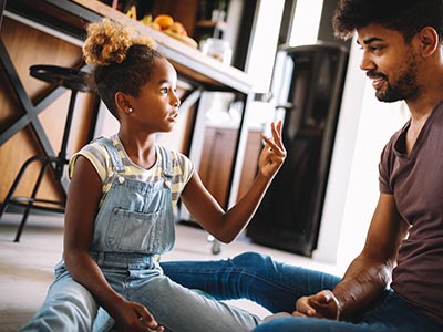 Father and daughter playing on the floor